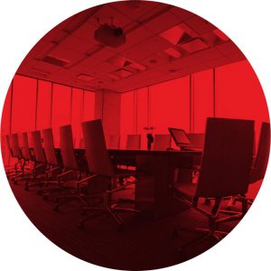 red overlay circle image of conference room