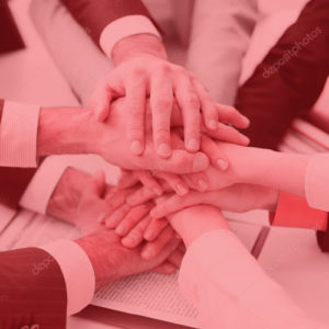 Hands joined together in team environment